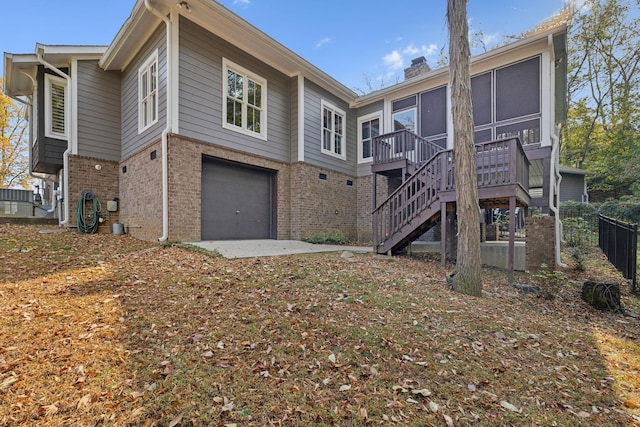 back of house with a garage