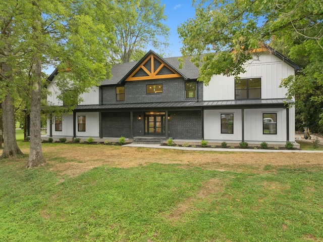 view of front facade with a front yard and a porch