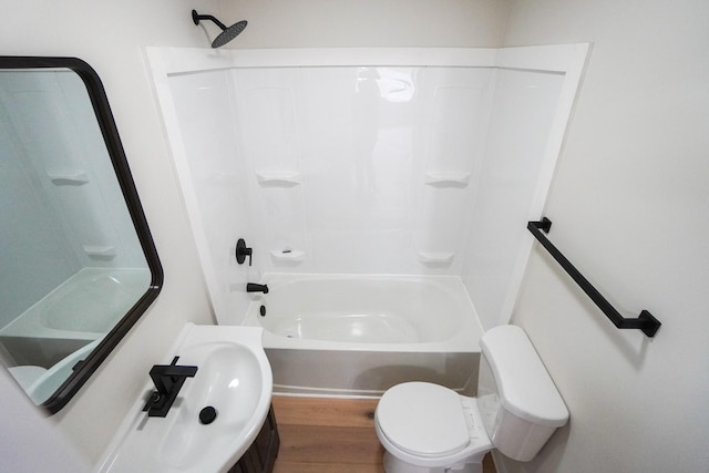 full bathroom with toilet, sink, shower / bathing tub combination, and hardwood / wood-style flooring