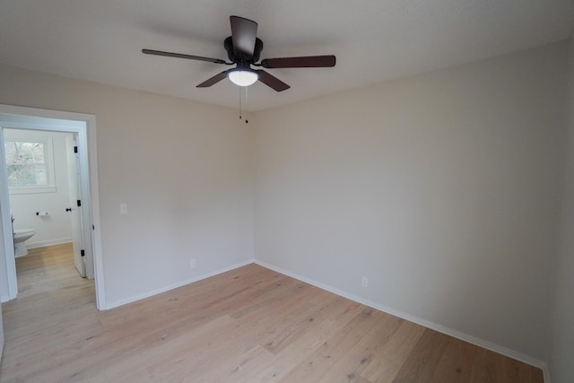 spare room featuring ceiling fan and light wood-type flooring