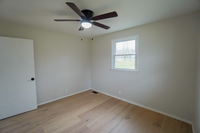 unfurnished room with ceiling fan and light hardwood / wood-style floors