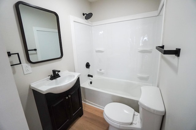 full bathroom with vanity, wood-type flooring,  shower combination, and toilet