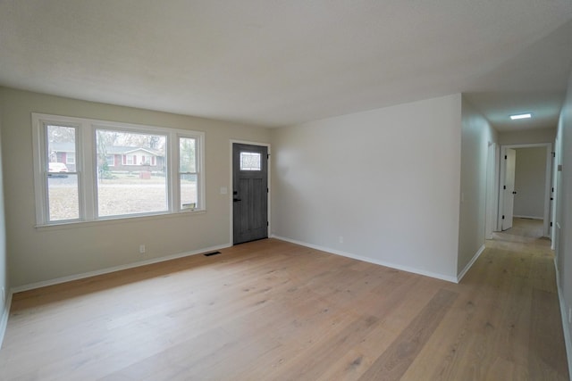 foyer with light wood-type flooring