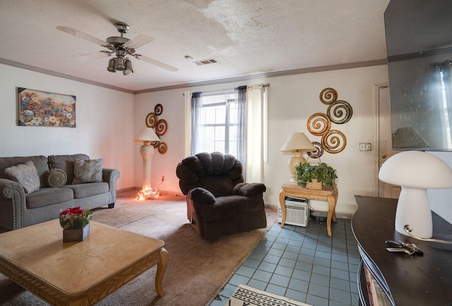 tiled living room featuring a textured ceiling, ceiling fan, and crown molding