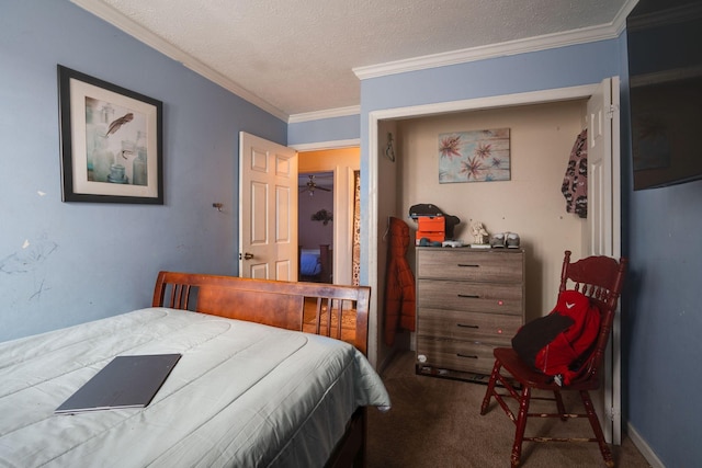 bedroom featuring a textured ceiling, ornamental molding, and carpet flooring