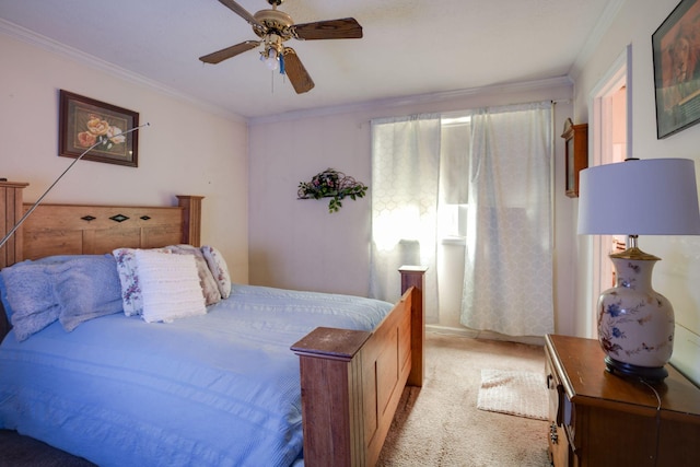 carpeted bedroom featuring ceiling fan and ornamental molding