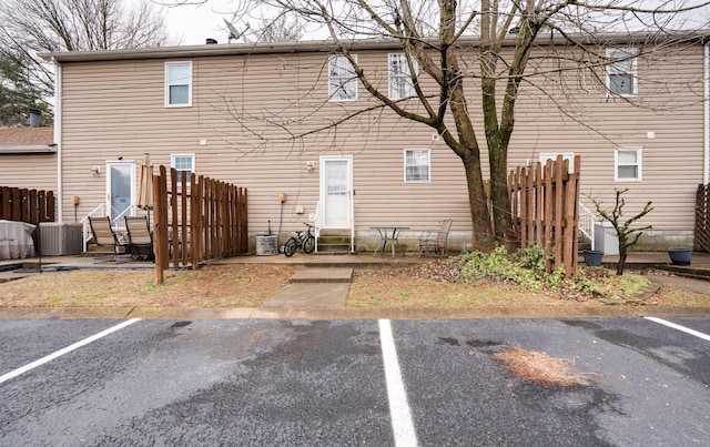 back of property with central AC unit