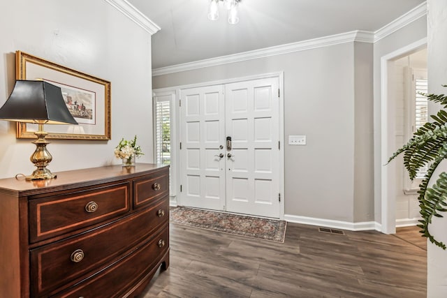 entrance foyer featuring dark hardwood / wood-style floors and crown molding