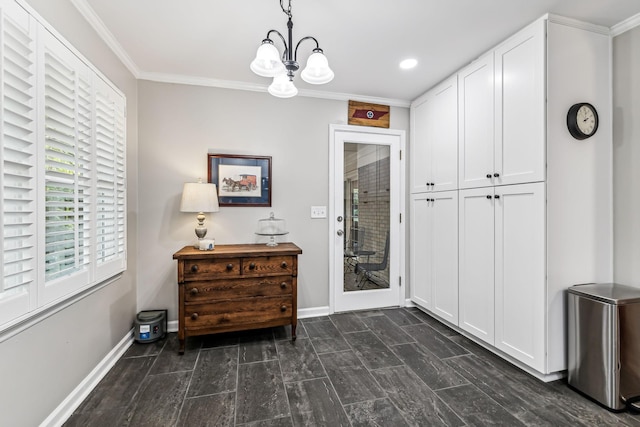 doorway to outside with a chandelier and crown molding