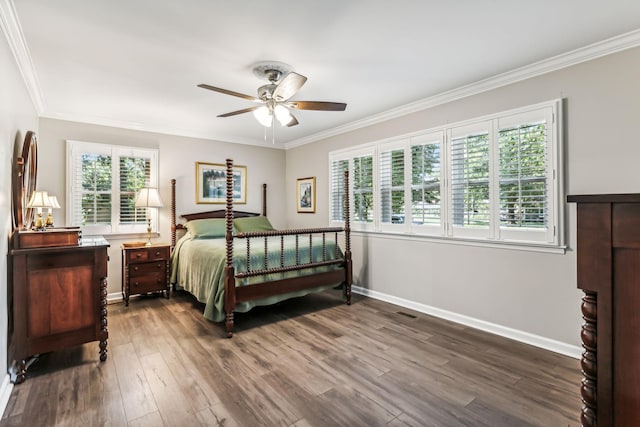 bedroom with ceiling fan, dark hardwood / wood-style floors, and ornamental molding