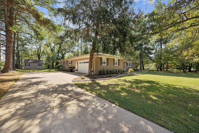 ranch-style home with a front yard and a garage