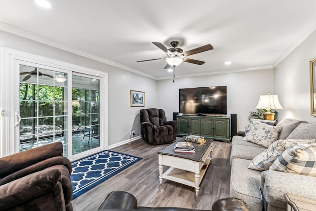 living room featuring crown molding, ceiling fan, and wood-type flooring