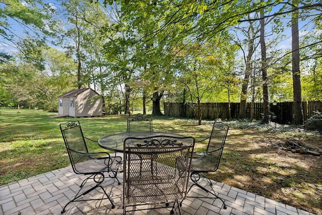 view of patio / terrace with a shed