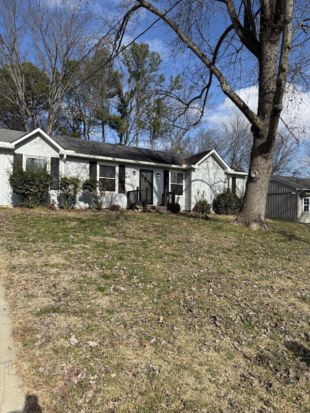 single story home featuring a front yard