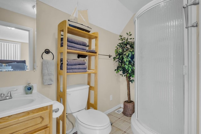 bathroom with toilet, vanity, vaulted ceiling, and walk in shower