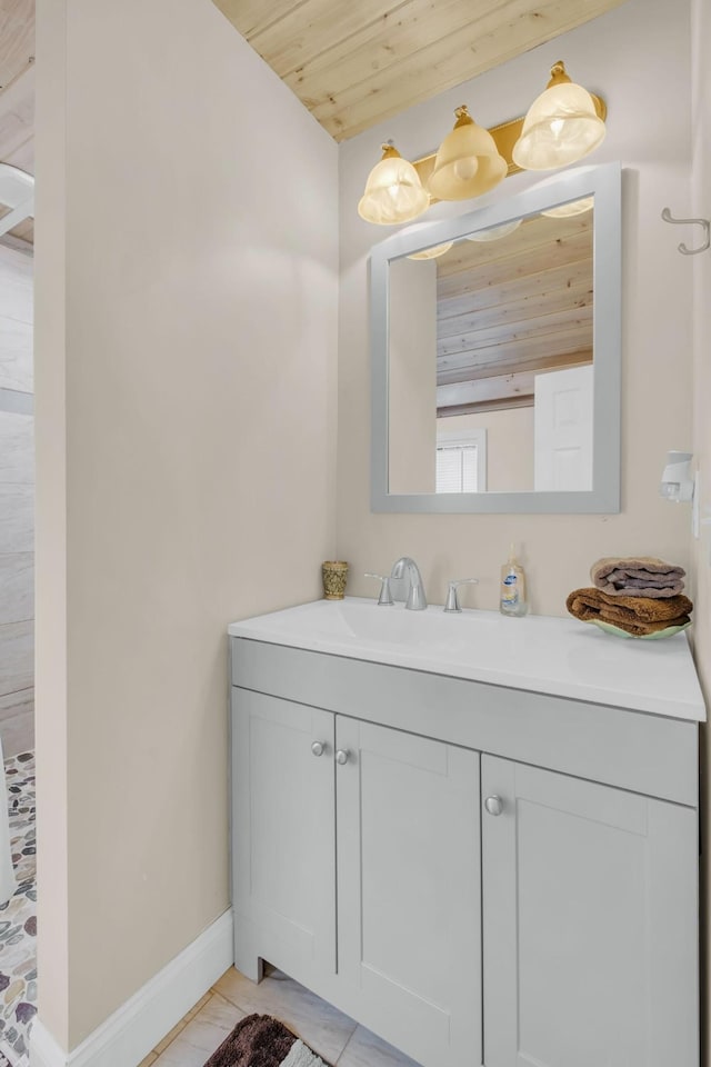 bathroom featuring vanity and wooden ceiling