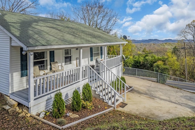 view of front of house with a mountain view and covered porch