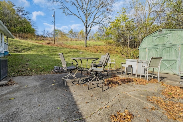 view of patio / terrace featuring a storage shed