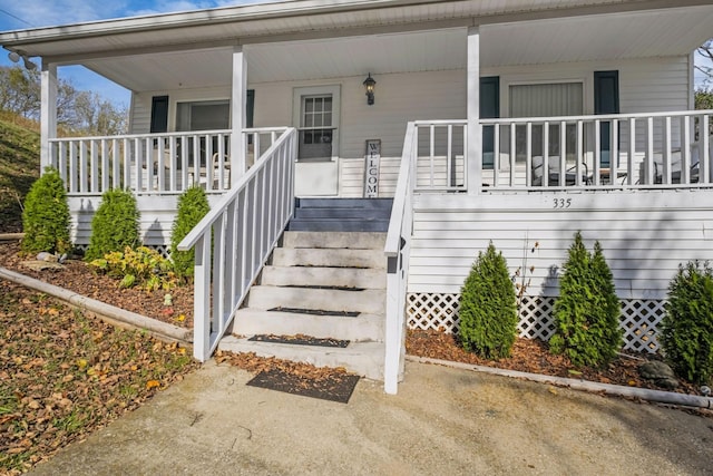 property entrance with covered porch