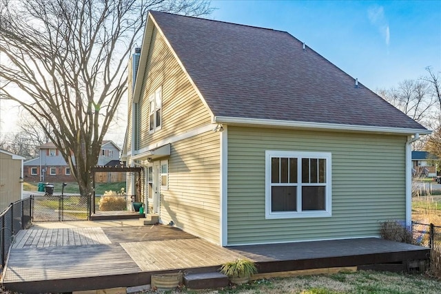 view of property exterior featuring a wooden deck