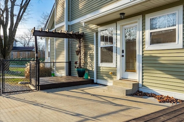 property entrance with a wooden deck