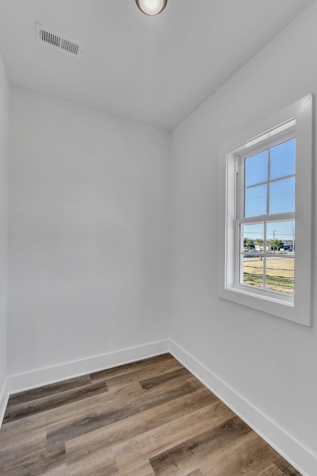 empty room with wood-type flooring