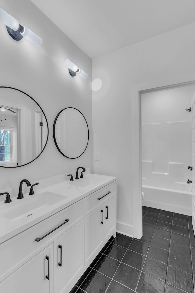 full bathroom with vanity, shower / bathing tub combination, tile patterned floors, and toilet