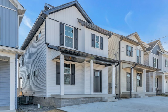 view of front of property featuring central AC unit and a porch