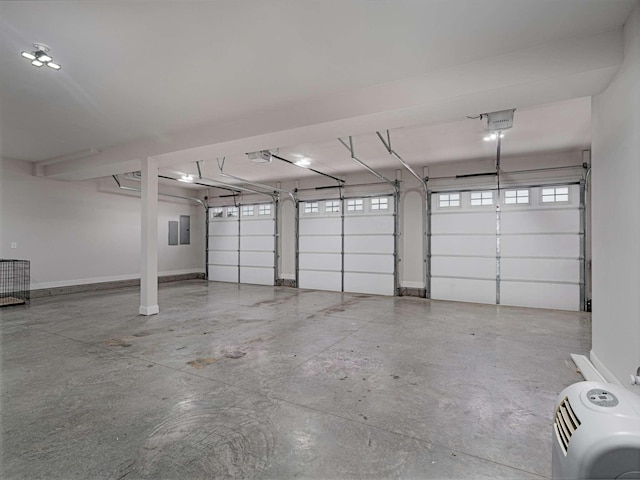 garage featuring electric panel, a garage door opener, and a carport