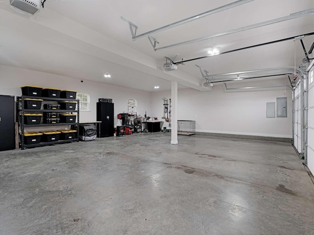 garage featuring electric panel and a garage door opener