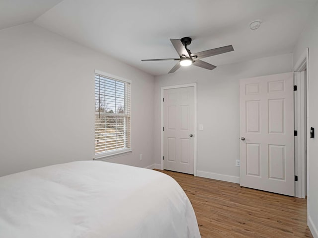 bedroom featuring ceiling fan and light hardwood / wood-style flooring