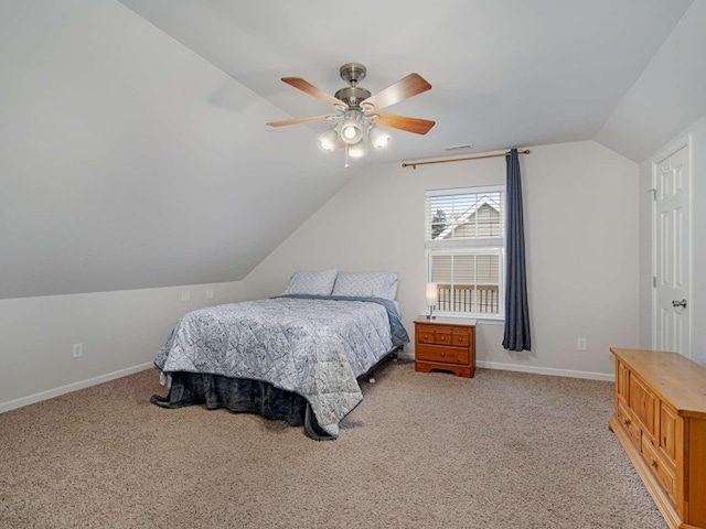 carpeted bedroom featuring ceiling fan and vaulted ceiling