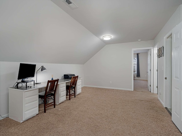 carpeted office space with lofted ceiling