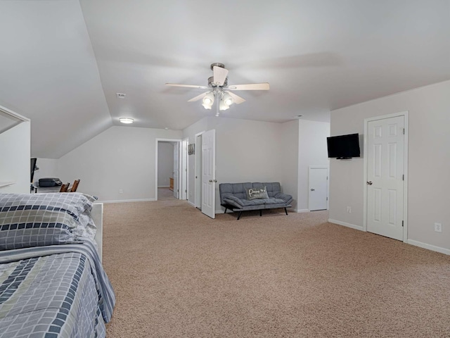 bedroom featuring ceiling fan, light colored carpet, and lofted ceiling