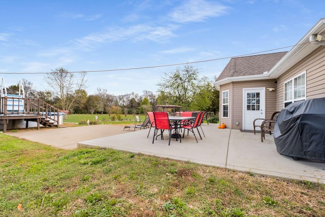 view of patio featuring a grill