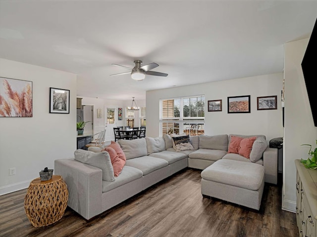 living room featuring ceiling fan and hardwood / wood-style floors