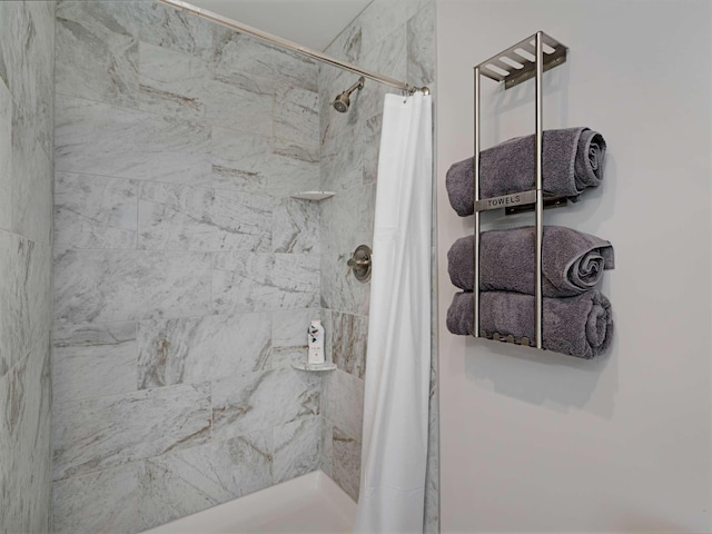 bathroom with a shower with shower curtain