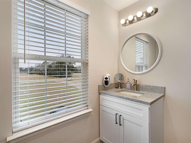 bathroom with vanity and plenty of natural light