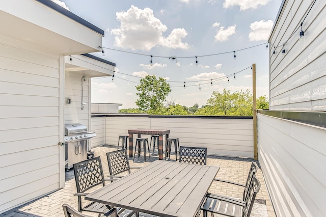 balcony with area for grilling and a patio