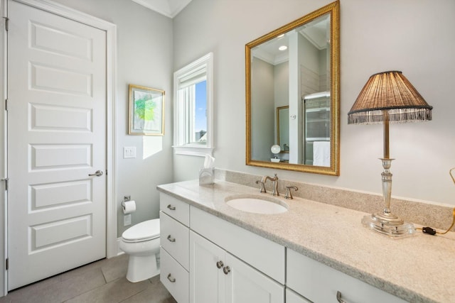 bathroom with walk in shower, tile patterned flooring, crown molding, toilet, and vanity