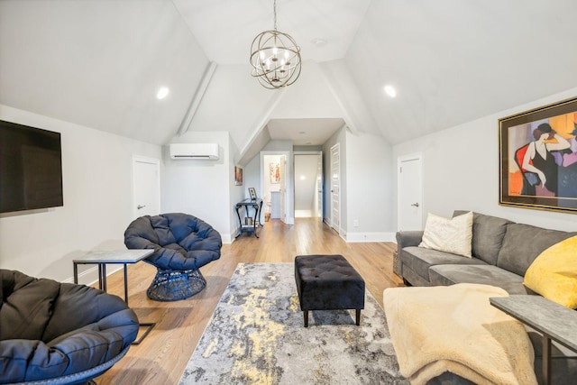 living room with a notable chandelier, vaulted ceiling, light hardwood / wood-style flooring, and a wall mounted AC