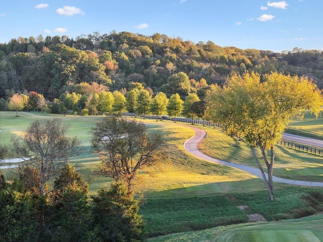 surrounding community with a lawn and a rural view