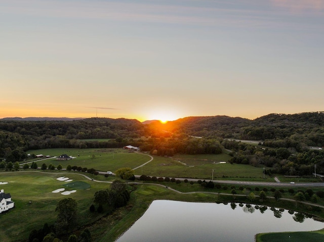 aerial view at dusk with a water view