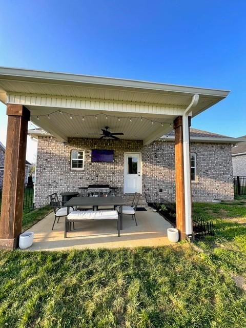 view of patio featuring ceiling fan