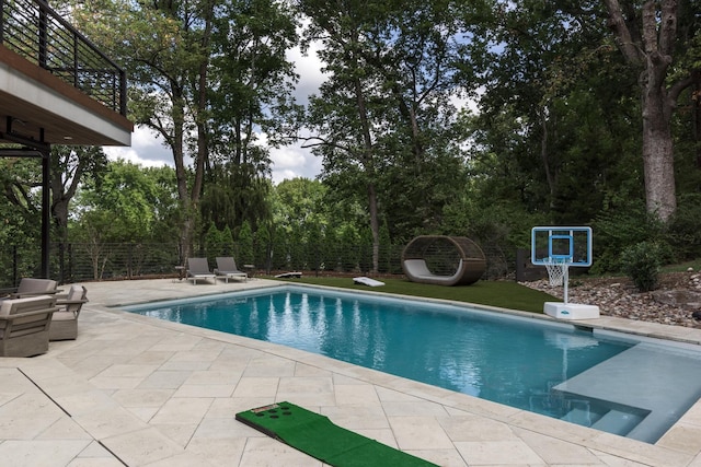 view of pool featuring a patio area