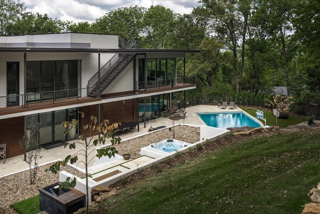 view of swimming pool featuring a yard and a patio