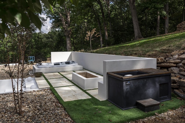 view of patio featuring a covered hot tub