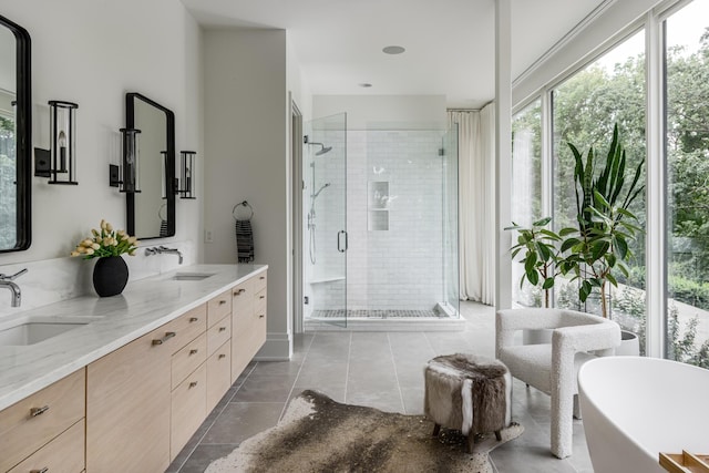 bathroom with tile patterned floors, vanity, and independent shower and bath