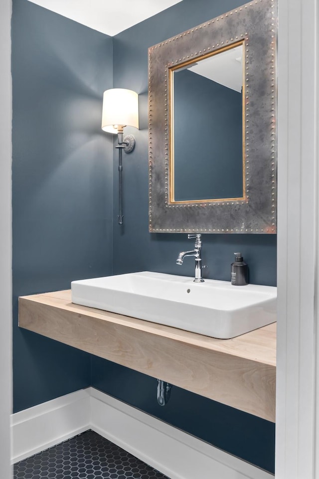 bathroom featuring tile patterned flooring and sink