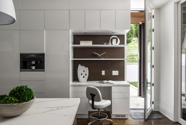 home office featuring dark hardwood / wood-style flooring